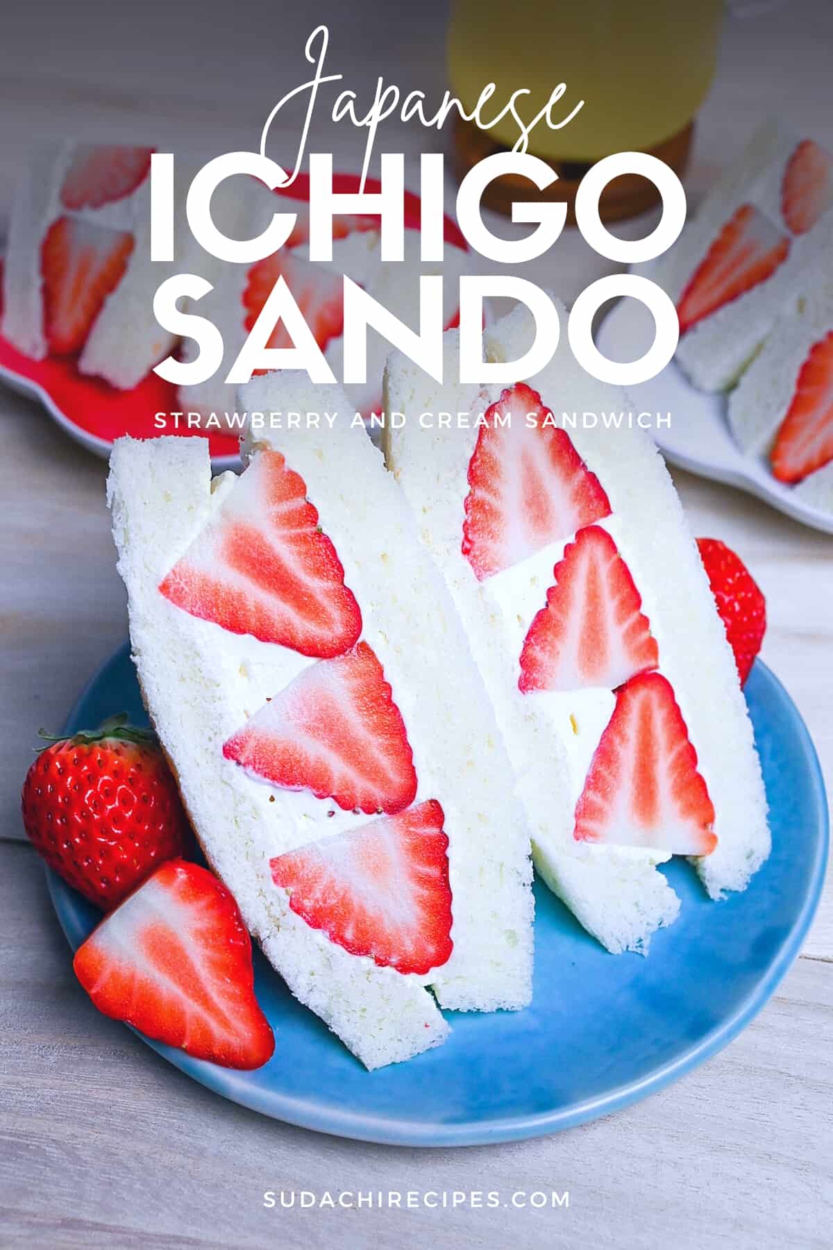 Japanese ichigo sando (strawberry sandwich) cut into triangles on a blue plate
