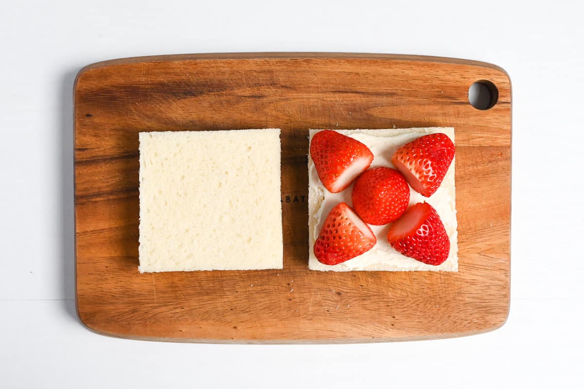 Arranging strawberries for ichigo sando (quarter triangles)