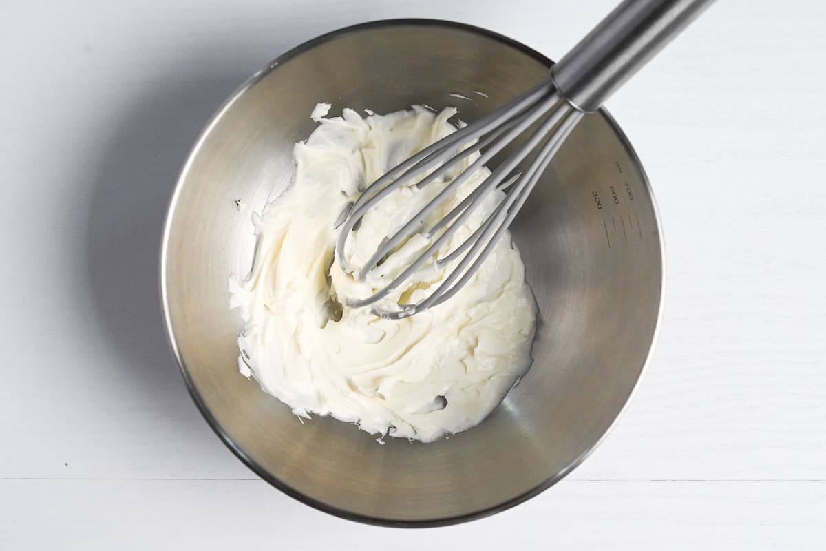 mascarpone cheese whisked with vanilla in a silver bowl