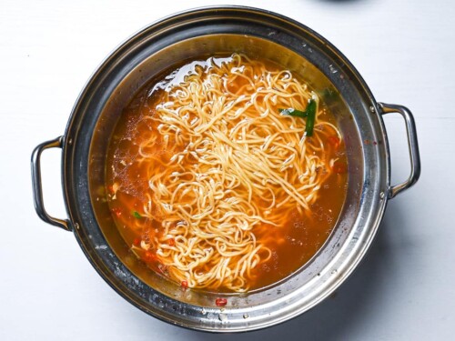Ramen noodles served in leftover motsunabe broth