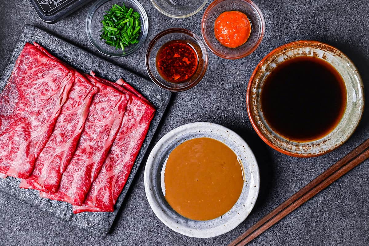 Thinly sliced cuts of wagyu beef, sesame sauce and ponzu sauce for shabu shabu