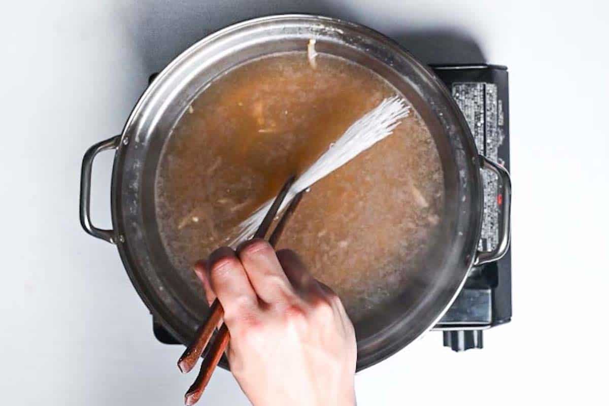 cooking glass noodles in the shabu shabu broth