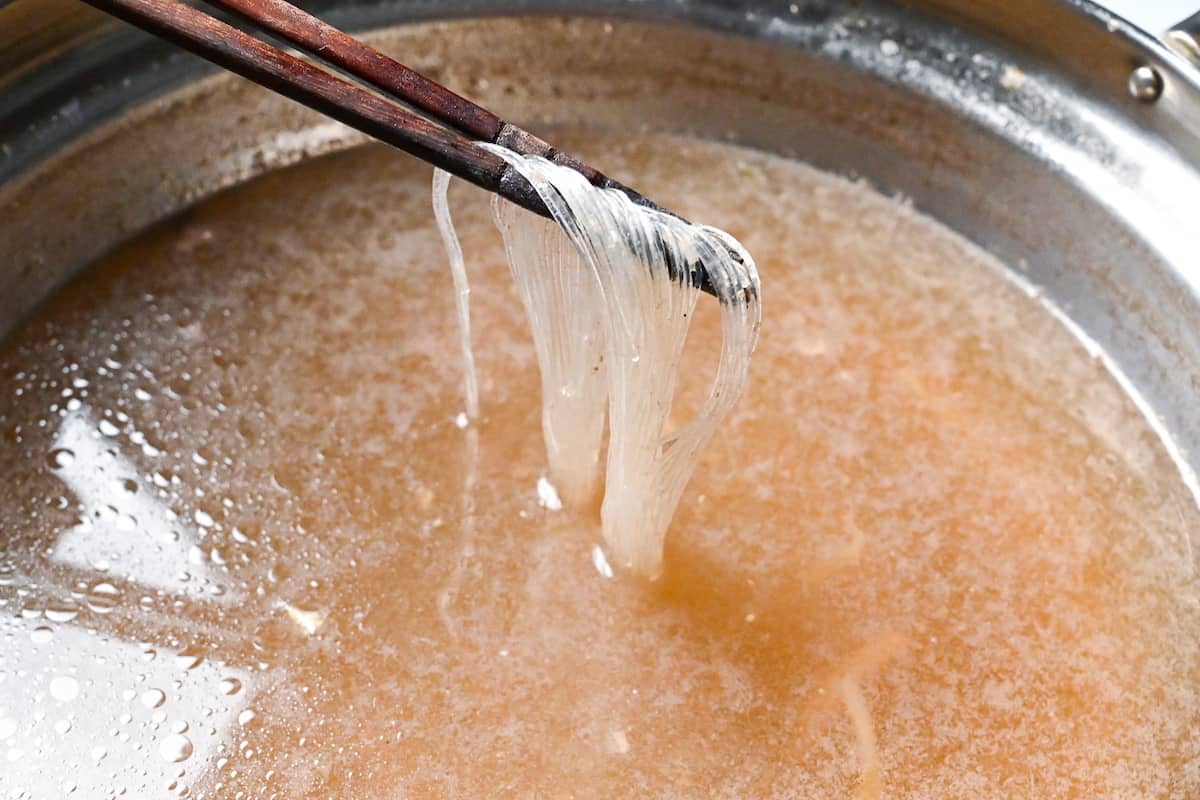 cooking glass noodles in the shabu shabu broth