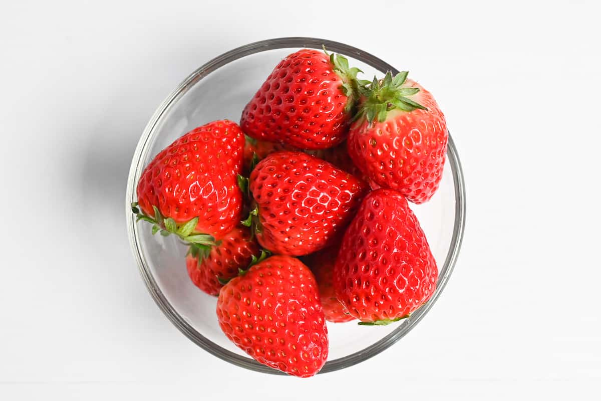 Fresh strawberries in a glass bowl