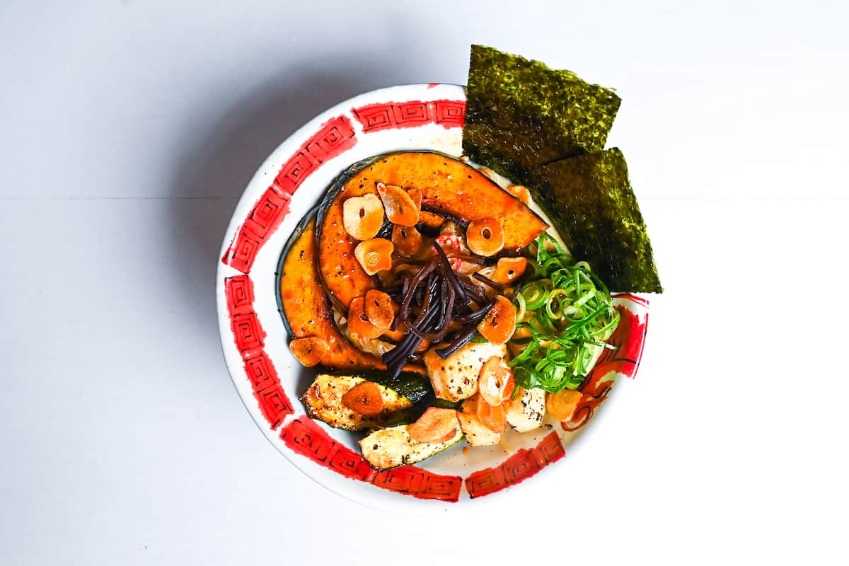 Vegetarian Spicy Miso Ramen topped with oven baked kabocha, zucchini and tofu