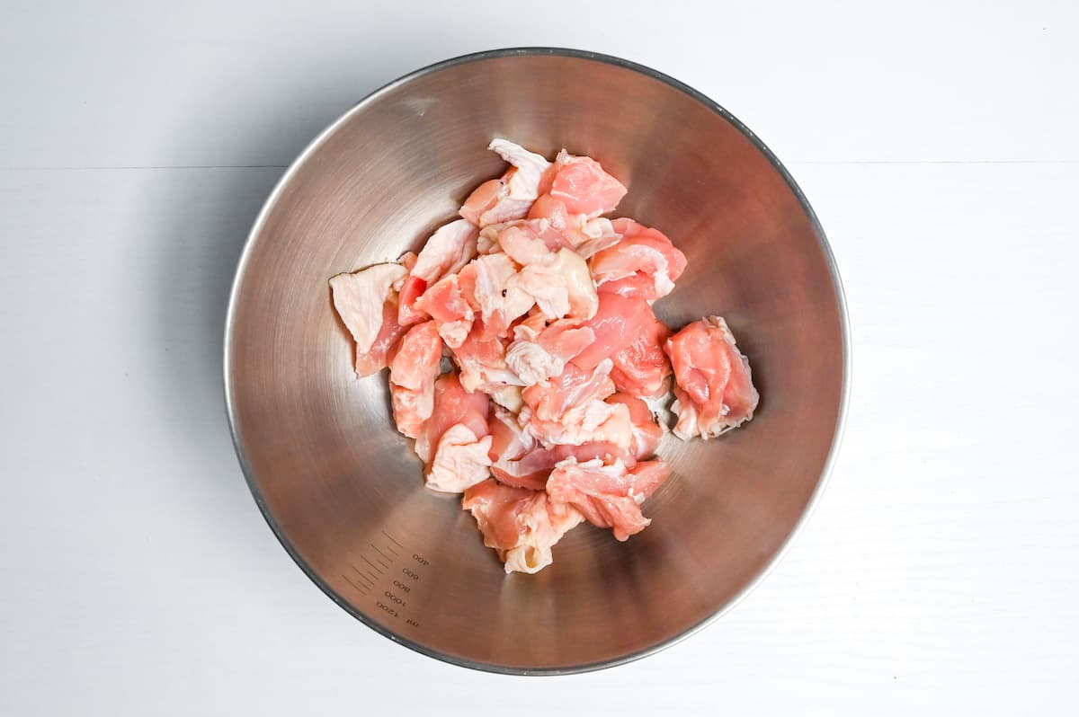 chicken thigh cut into bitesize pieces in a bowl