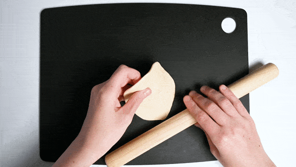 rolling the edges of the nikuman dough