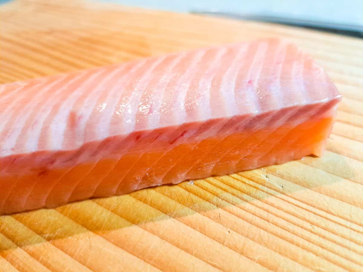 Sashimi grade salmon from its side