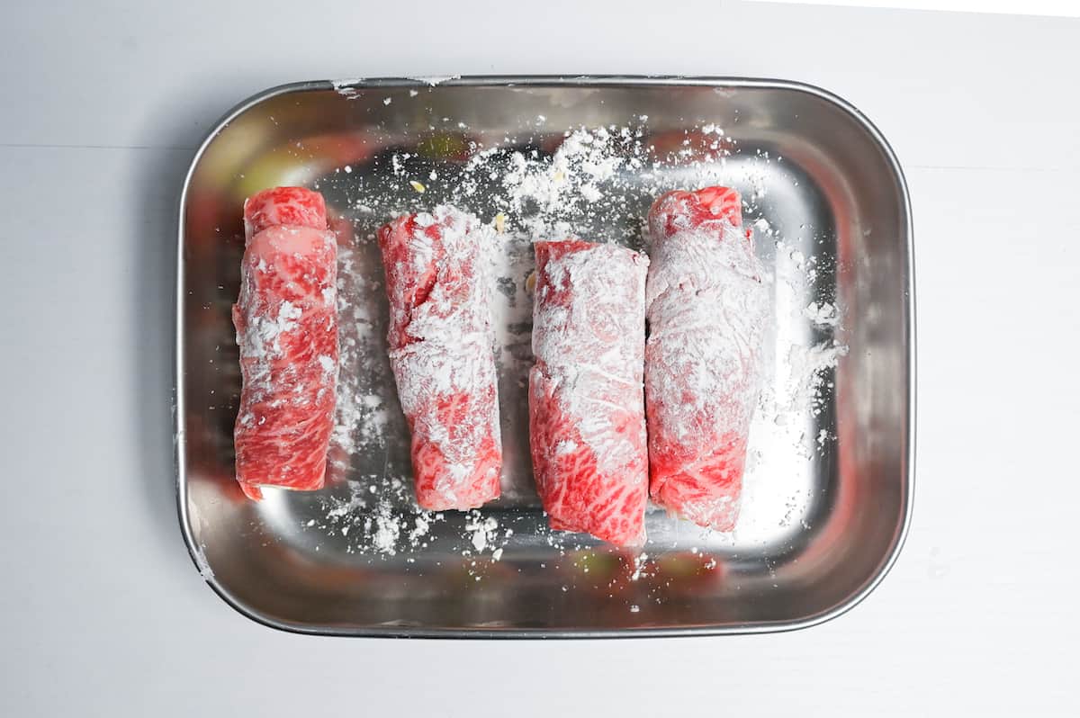 Beef negimaki coated with a thin layer of flour