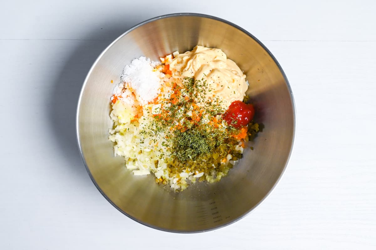 Japanese tartar sauce ingredients in a steel mixing bowl