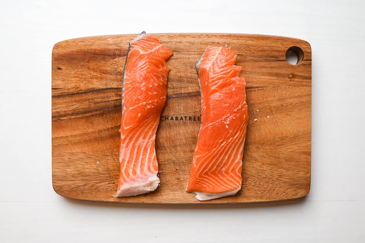 Sprinkling salmon with salt