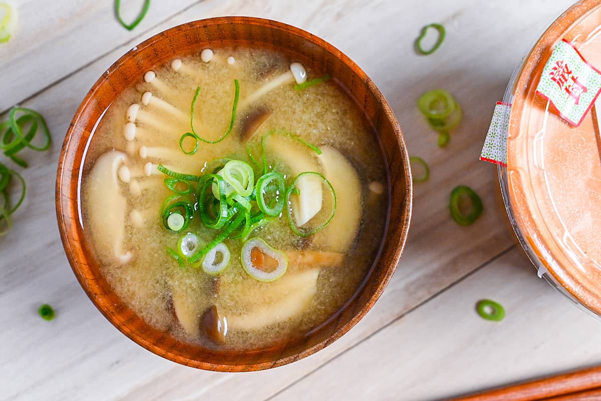 Mushroom miso soup made with 4 kinds of mushroom served in a wooden bowl top down view