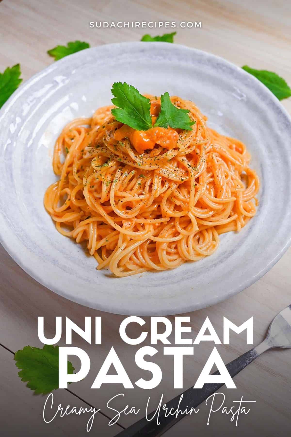 Japanese uni cream pasta served on a white plate and topped with black pepper and parsley
