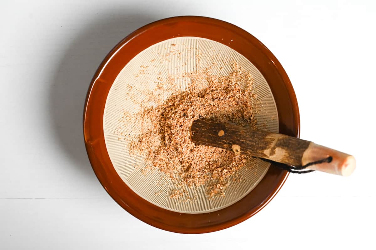 ground sesame seeds with a Japanese style mortar and pestle