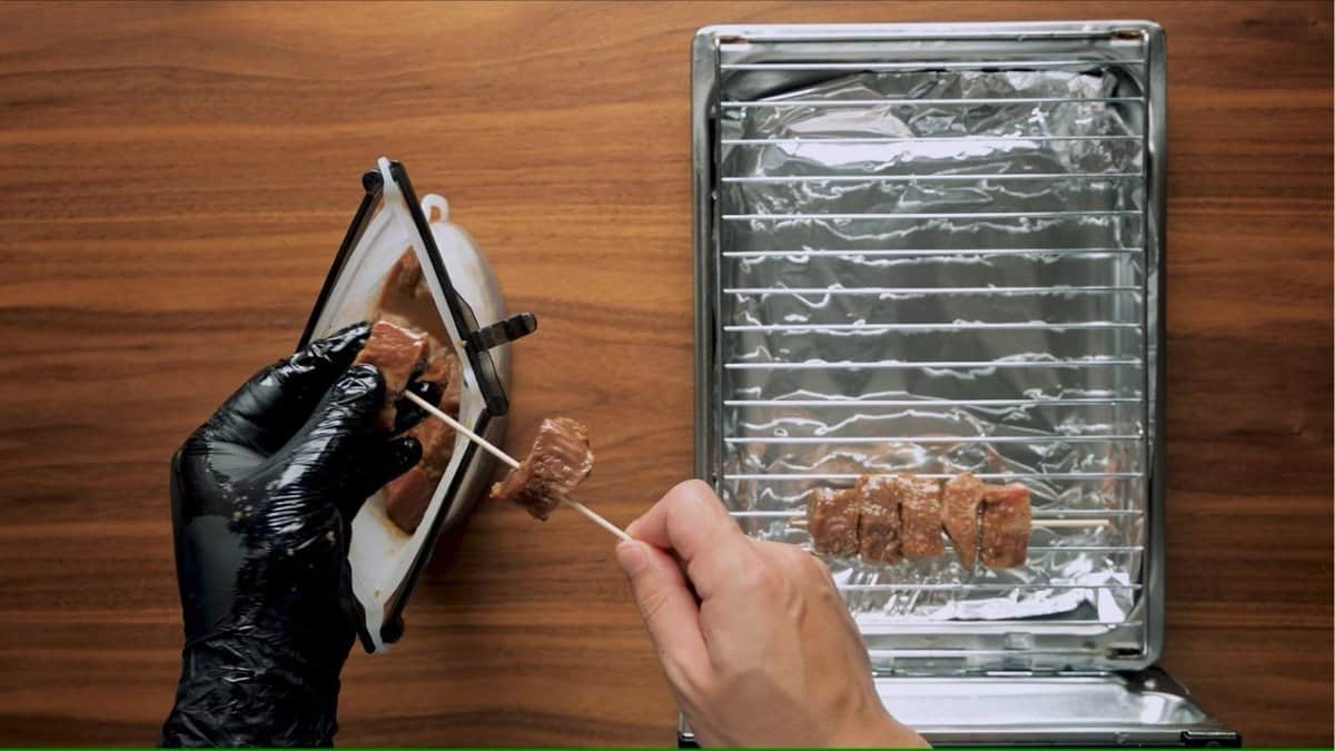 Skewering beef steak for kushiyaki