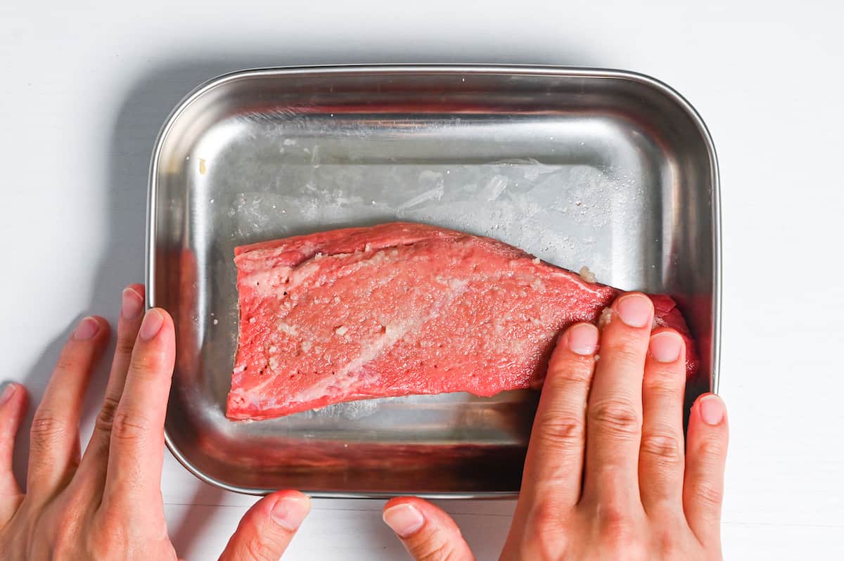 seasoning surface of fillet of beef