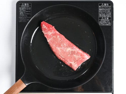searing fillet of beef in an iron skillet