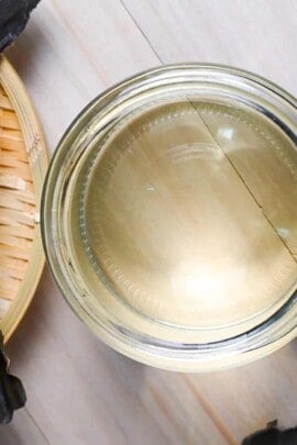 kombu dashi in a glass jar surrounded by kombu
