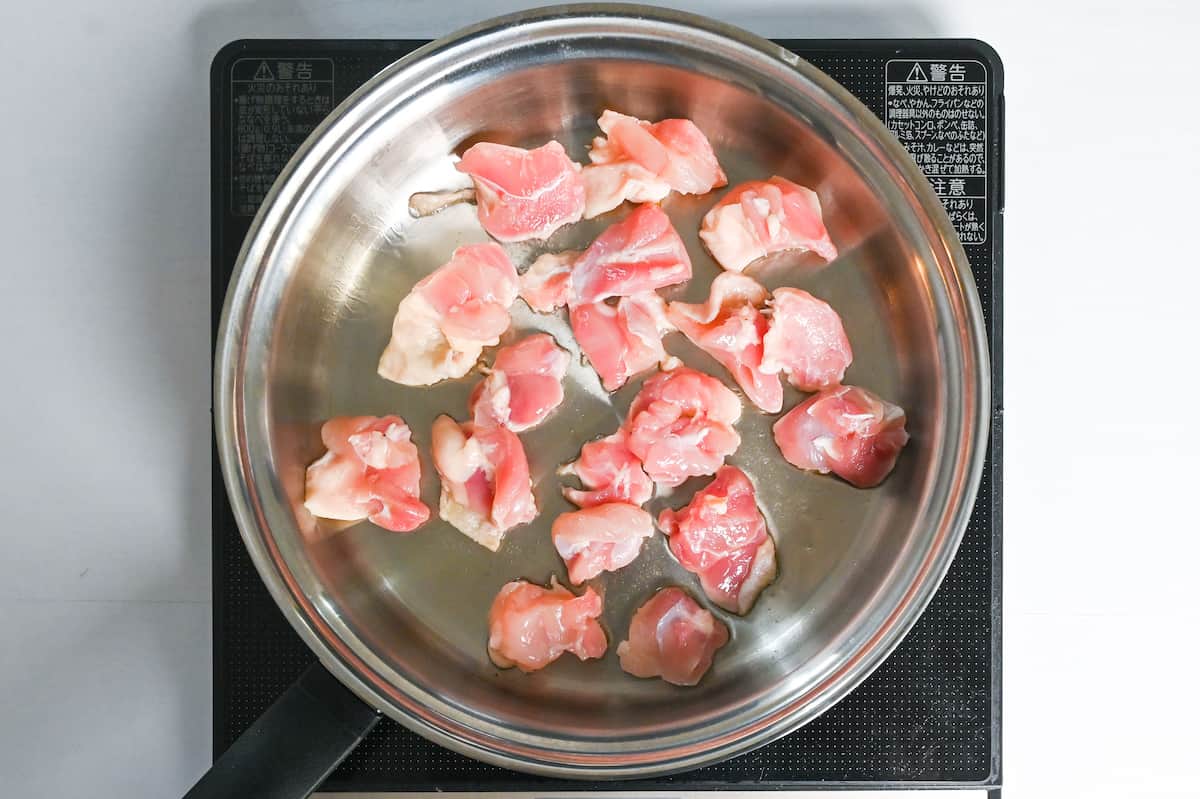 Sealing chicken thigh in a pan