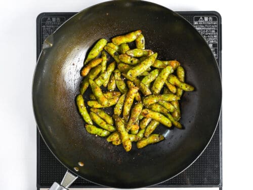 garlic and oyster sauce glazed edamame sprinkled with black pepper