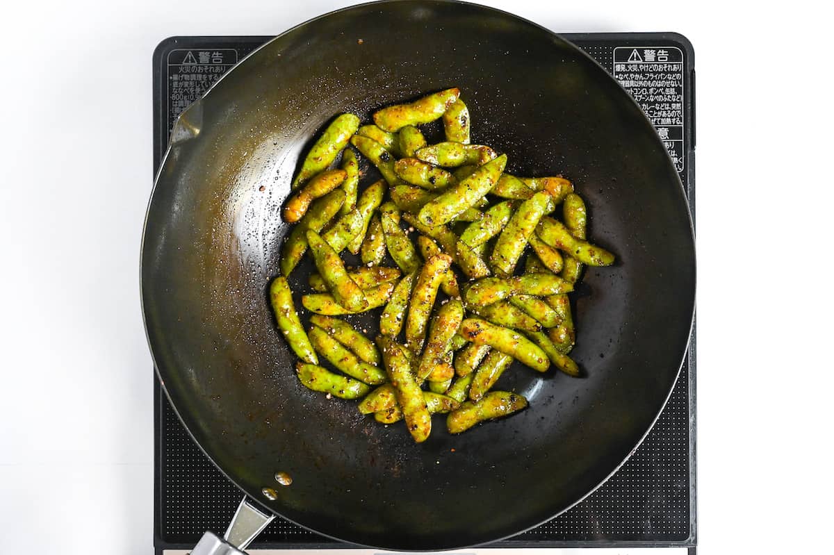 garlic and oyster sauce glazed edamame sprinkled with black pepper
