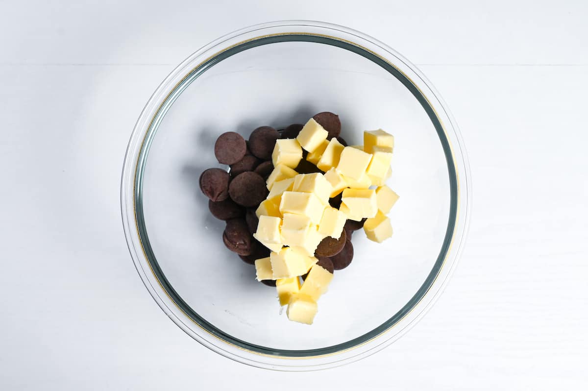 dark chocolate and cubed butter in a microwavable bowl