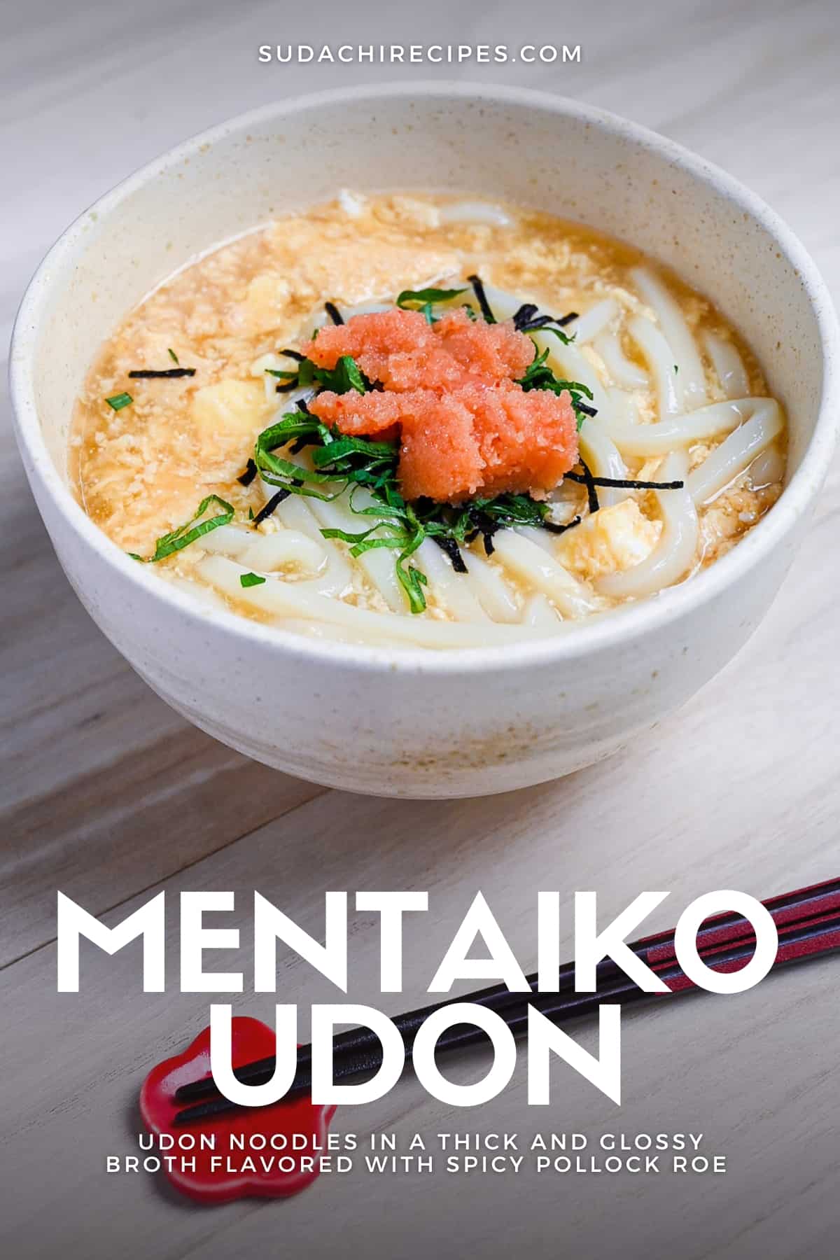 Mentaiko ankake udon served in a cream bowl and topped with shiso leaves. pin image
