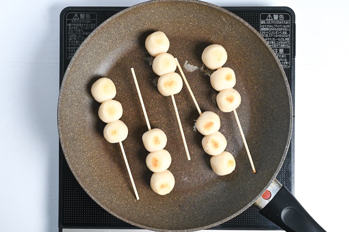 dango toasting in a frying pan