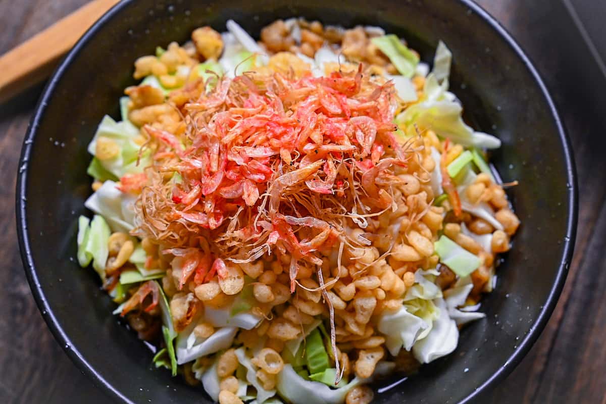 Monjayaki (teppan fried batter) ingredients in a black bowl