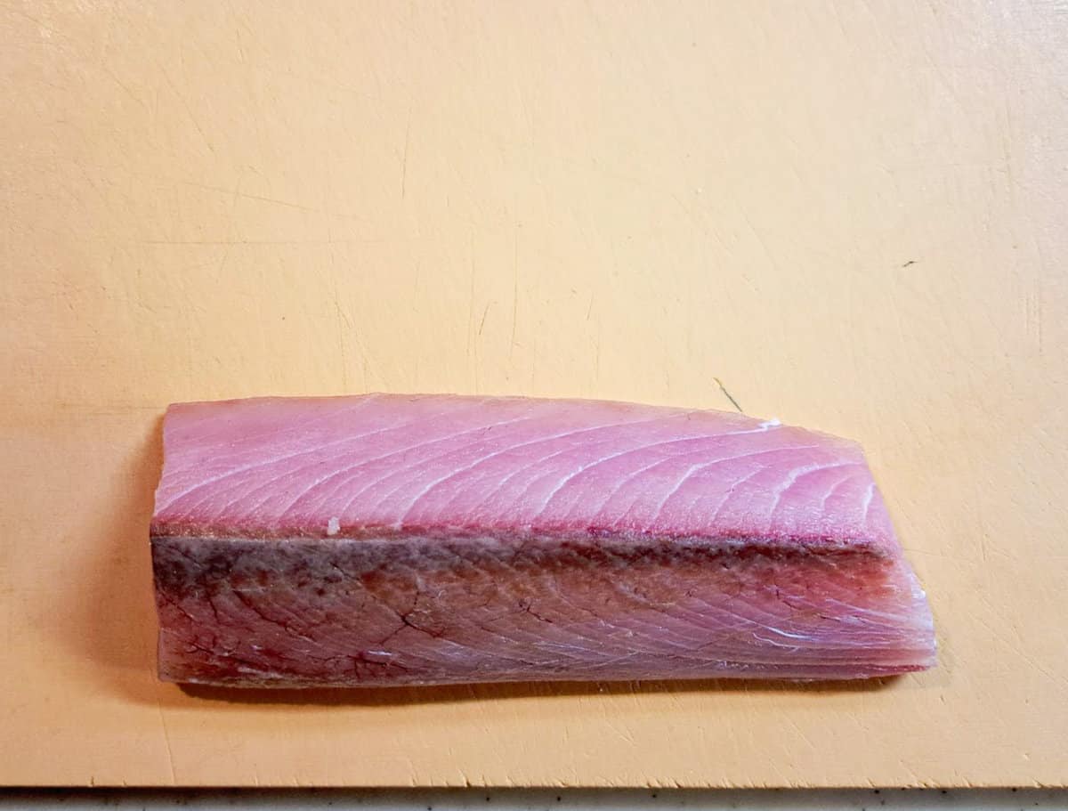 yellowtail sashimi place on a chopping board