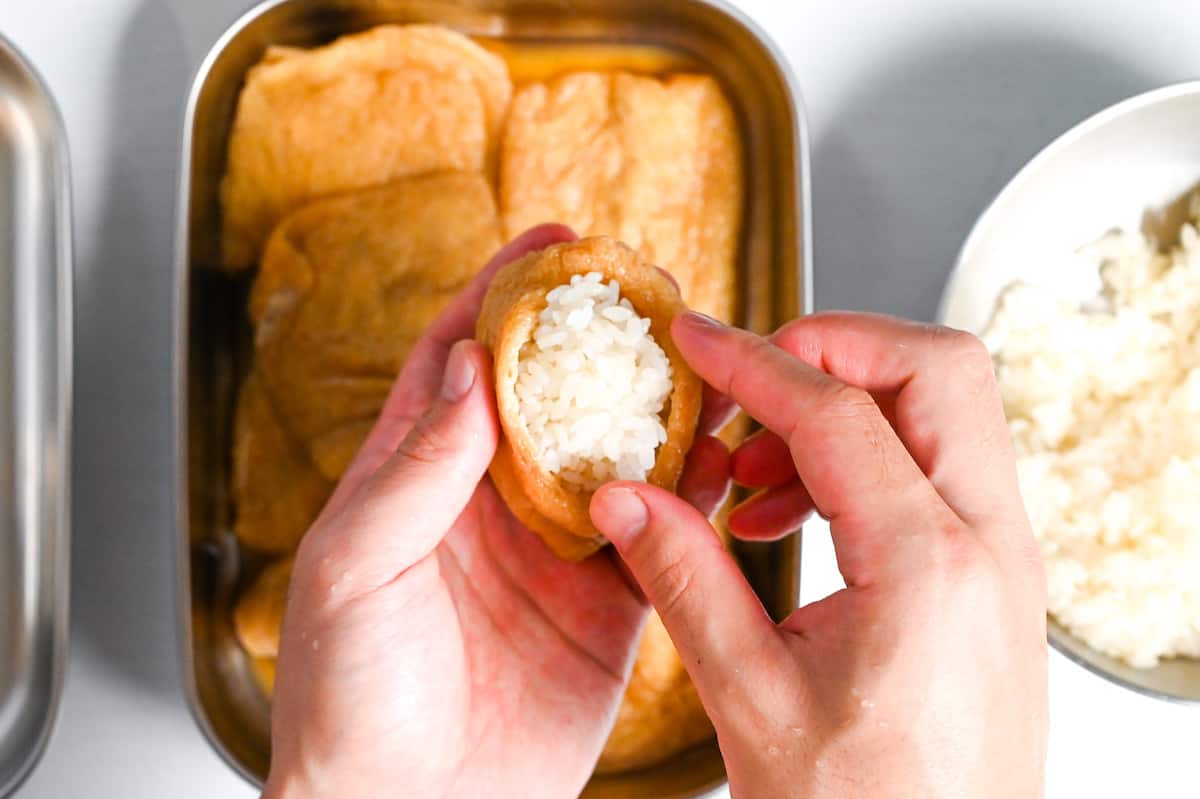 stuffing rice into dried tofu pouch