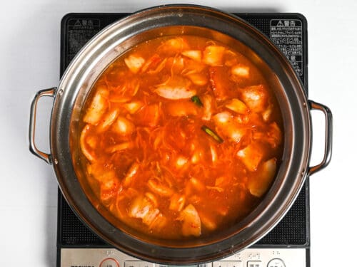 kimchi nabe broth simmering in a pot