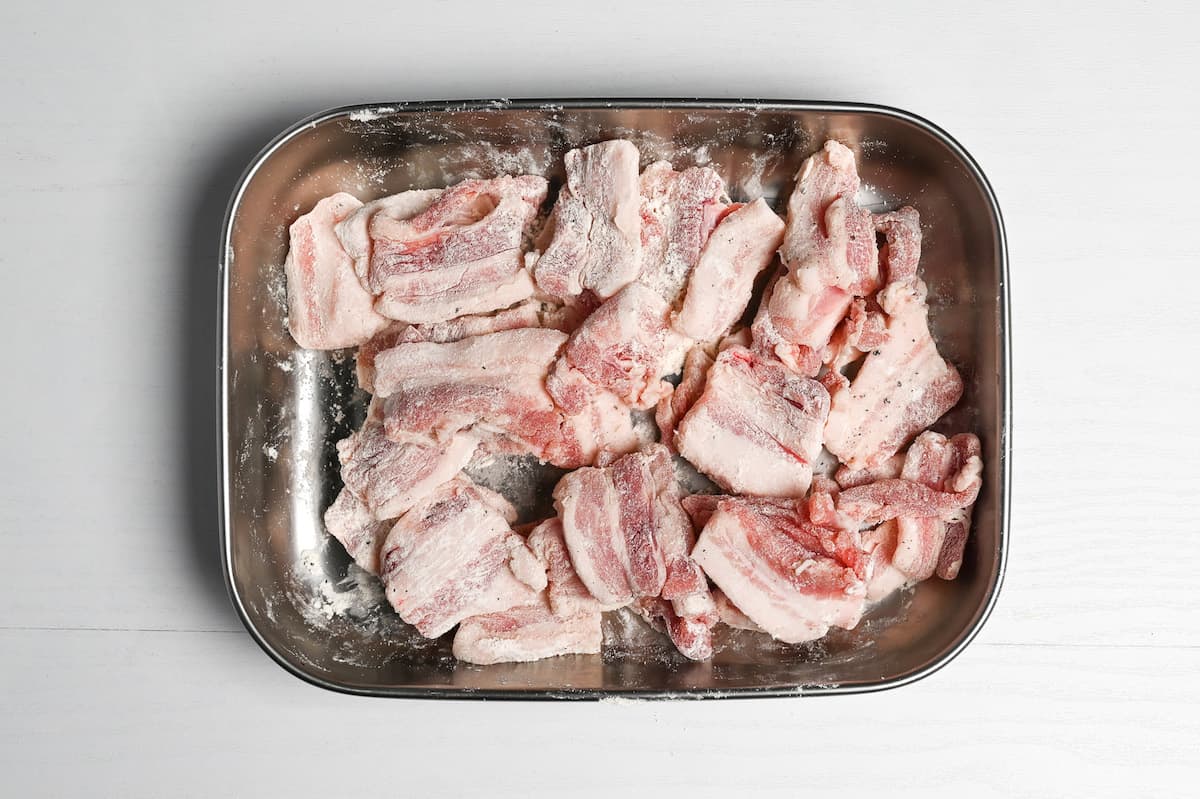 thick slices of pork belly coated with flour