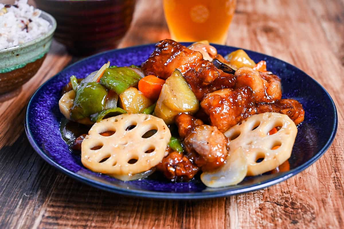 Japanese black vinegar chicken and vegetables (Ootoya style tori to yasai no kurozu an) on a blue plate