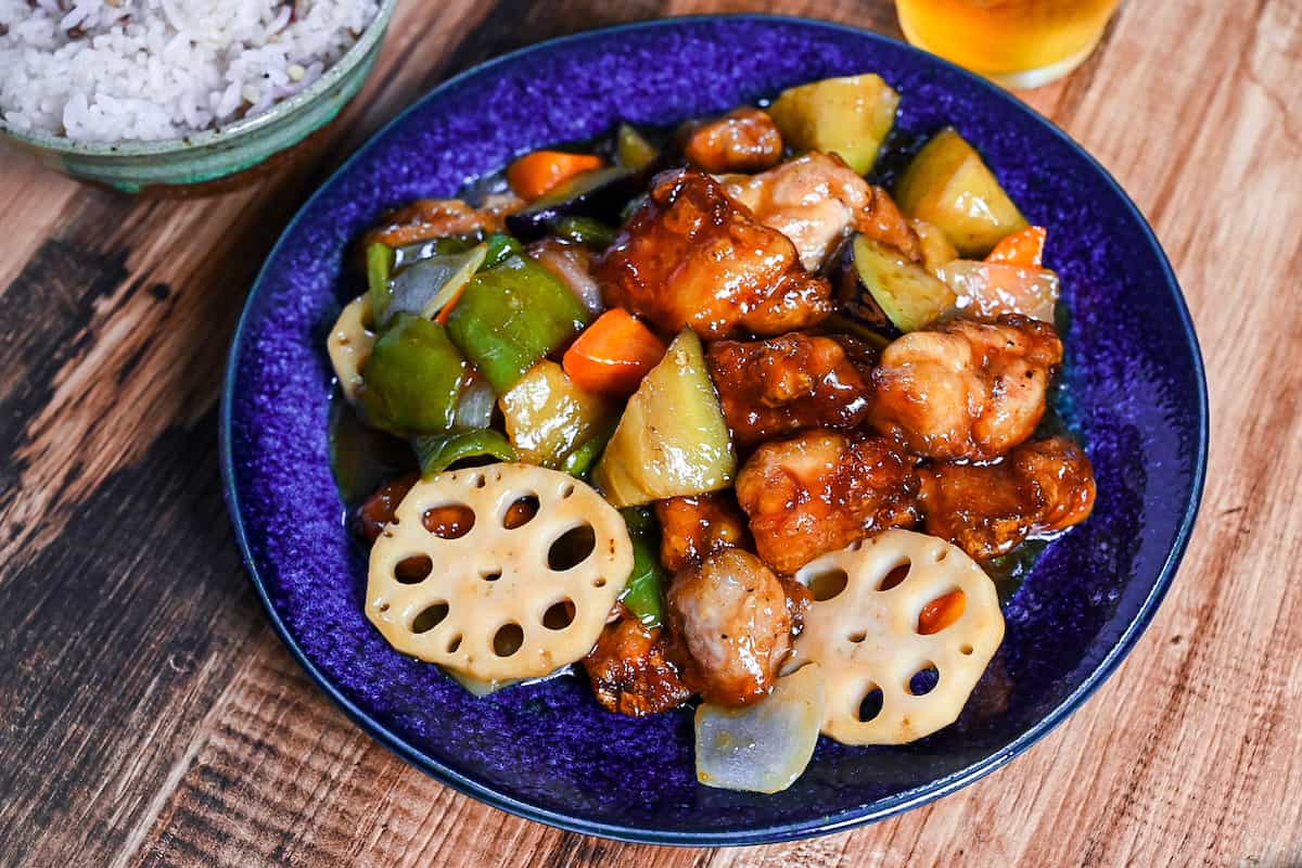 Ootoya style tori to yasai no kurozu an (Japanese black vinegar sweet and sour chicken and vegetables) on a blue plate