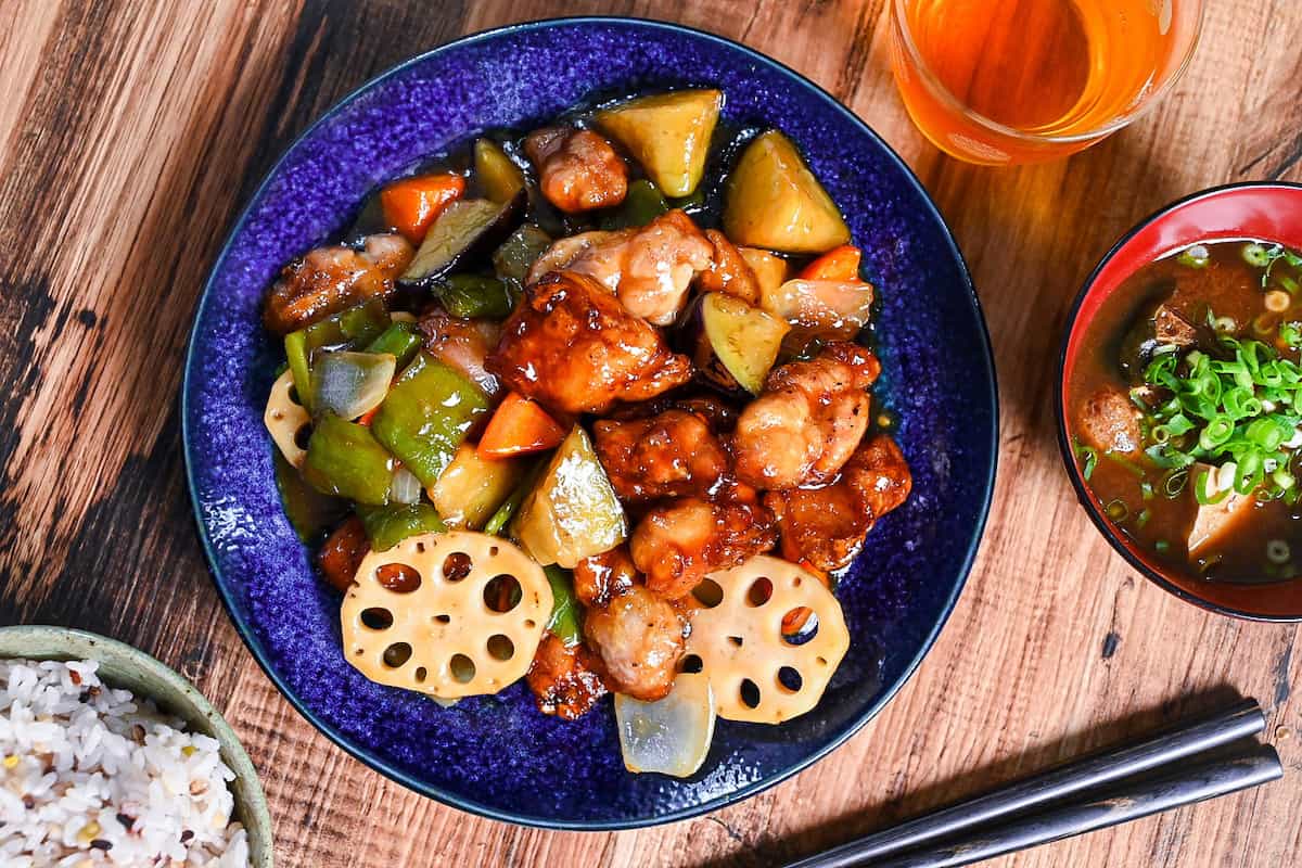 Ootoya style tori to yasai no kurozu an (Japanese black vinegar sweet and sour chicken and vegetables) on a blue plate