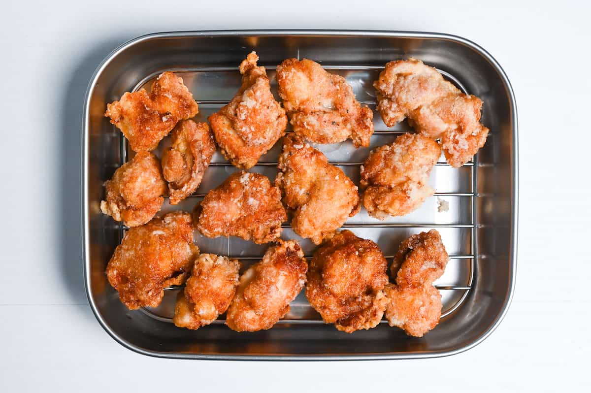 fried chicken resting on a wire rack