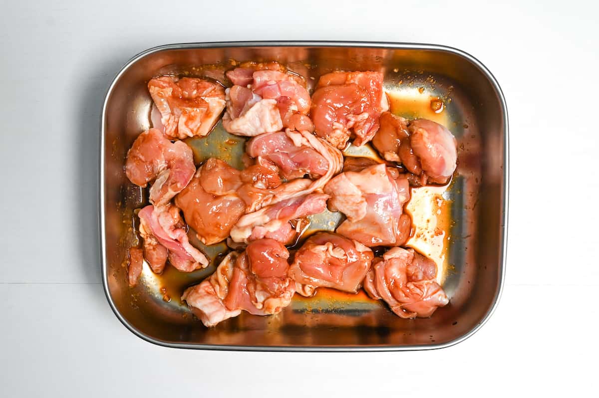 marinating chicken thigh in a metal container
