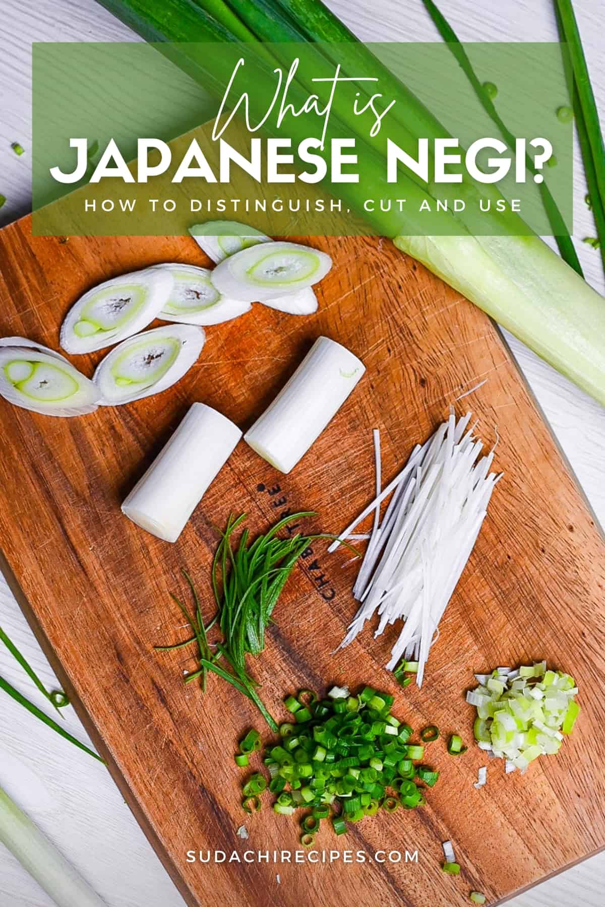 Japanese negi (green onion) cut in various ways on a wooden chopping board
