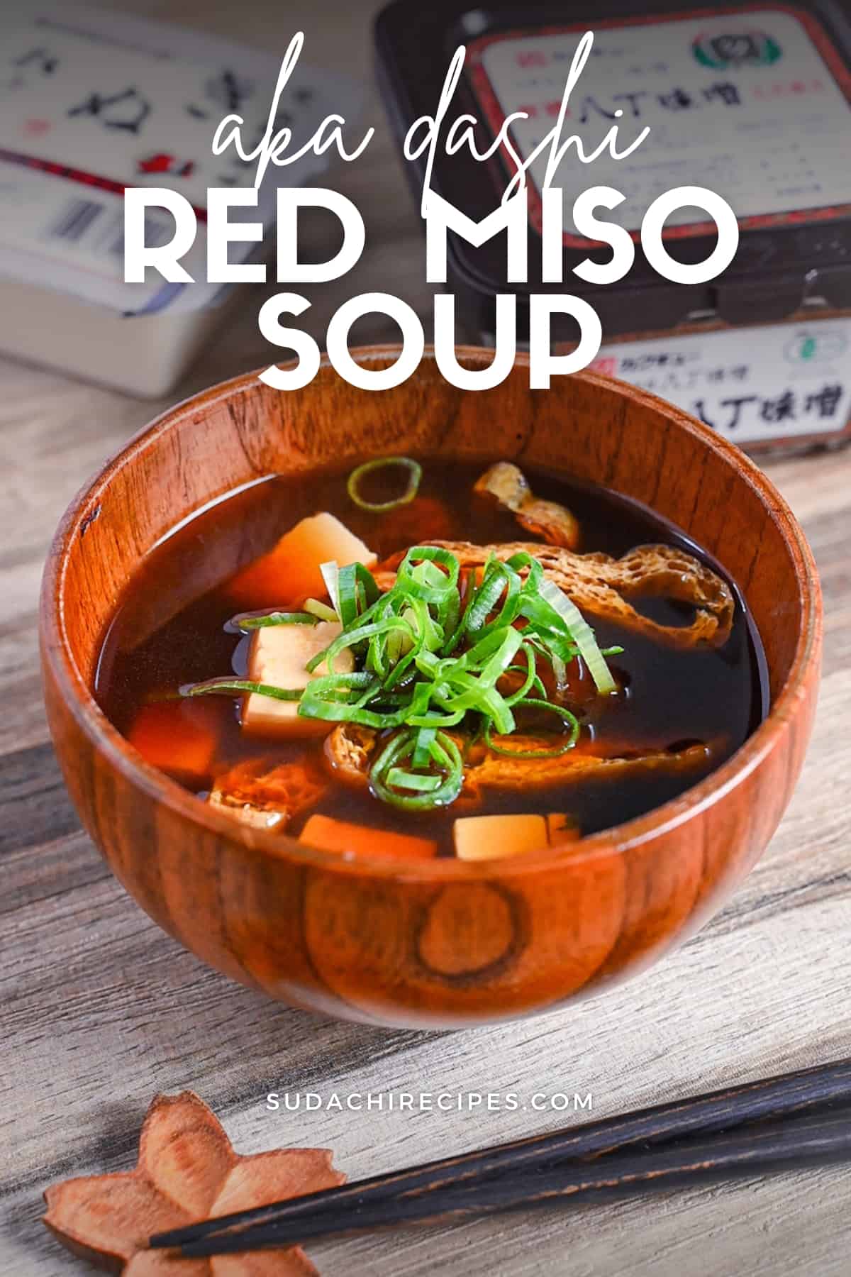aka-dashi (red miso soup) in wooden bowl topped with chopped green onion