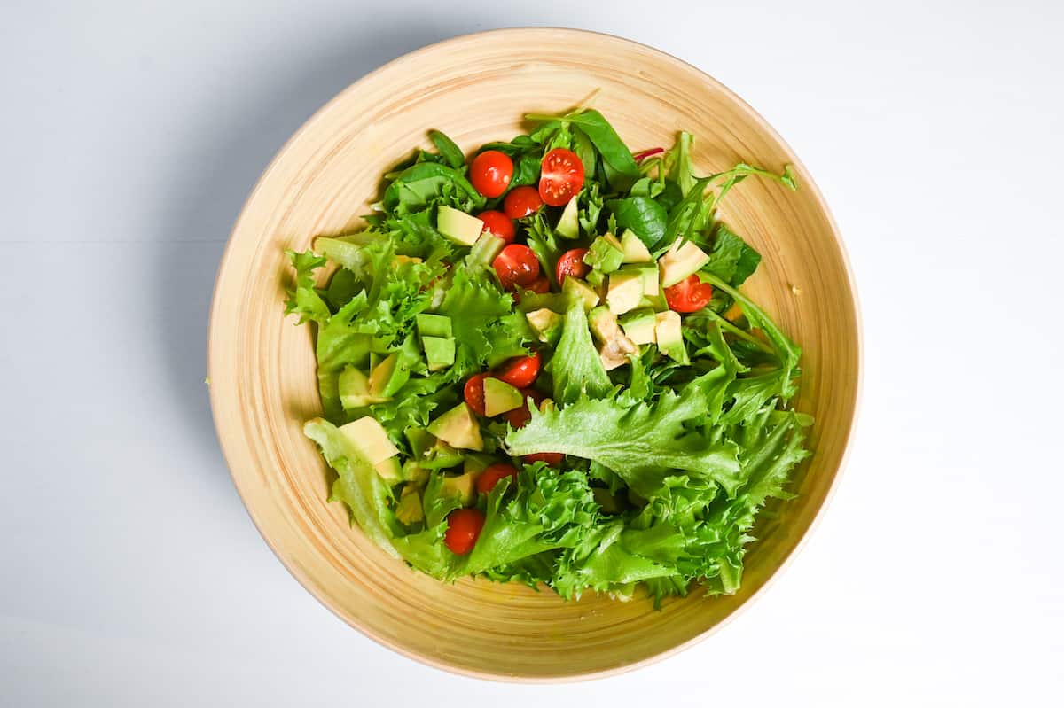 salad vegetables in a large wooden bowl