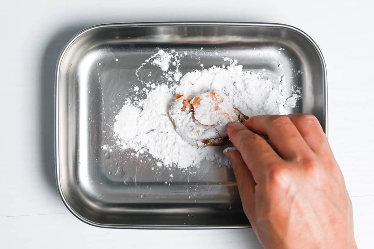 coating marinated chicken thigh in potato starch