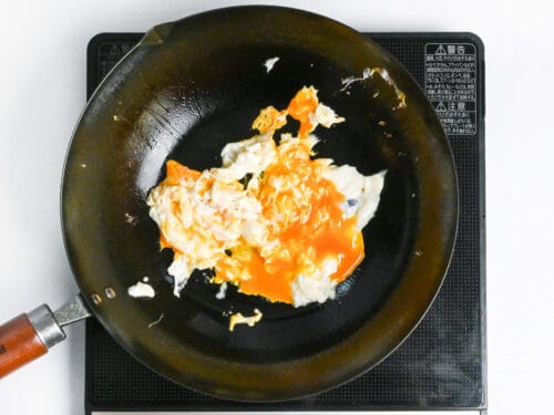 fried egg in a wok