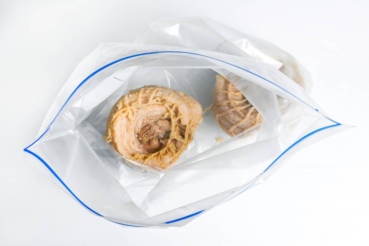 simmered pork belly cooled and placed in a zip lock bag