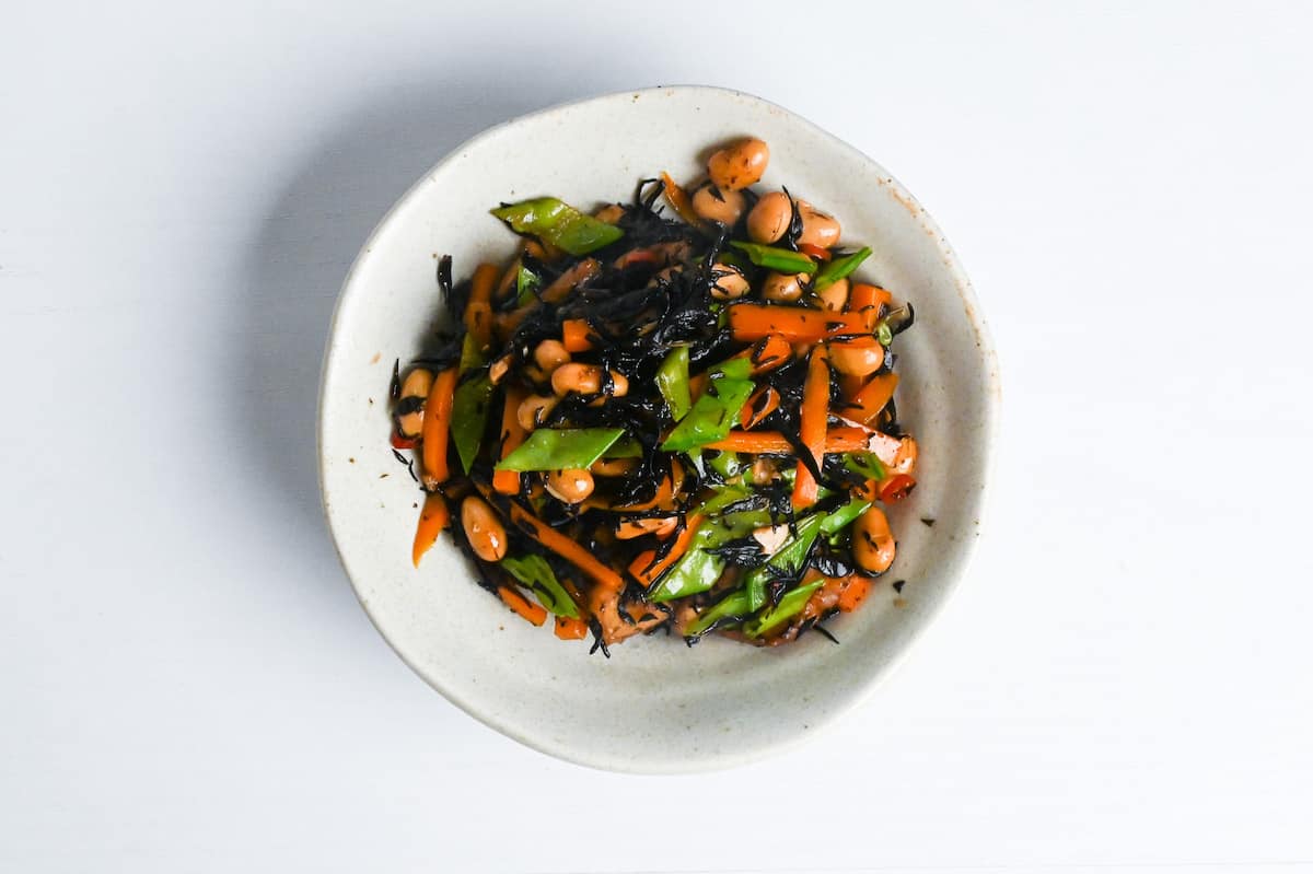 Hjiki salad in a white bowl on a white background
