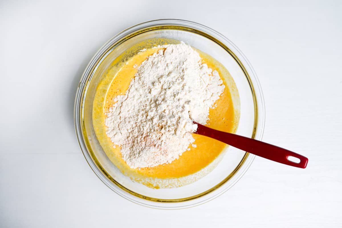 mixing dry ingredients into wet ingredients to make kabocha loaf