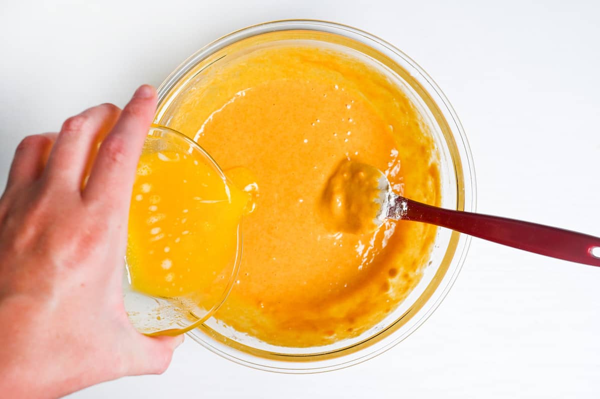 pouring melted butter into kabocha loaf batter