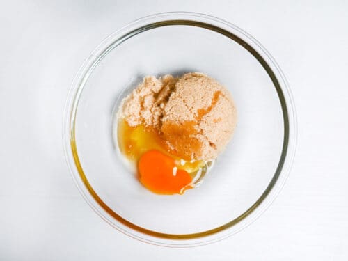 light brown sugar and egg in a bowl