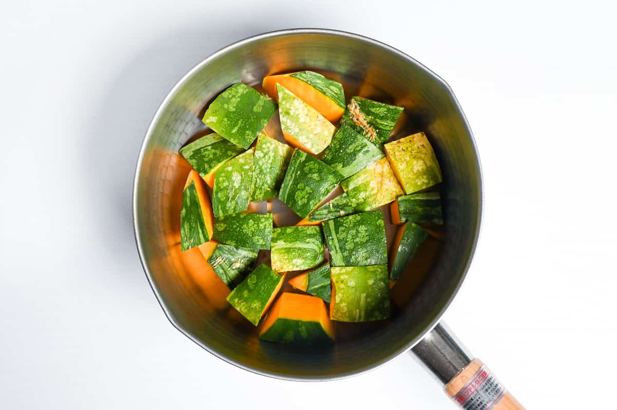 Bitesize pieces of Kabocha Japanese squash in a saucepan