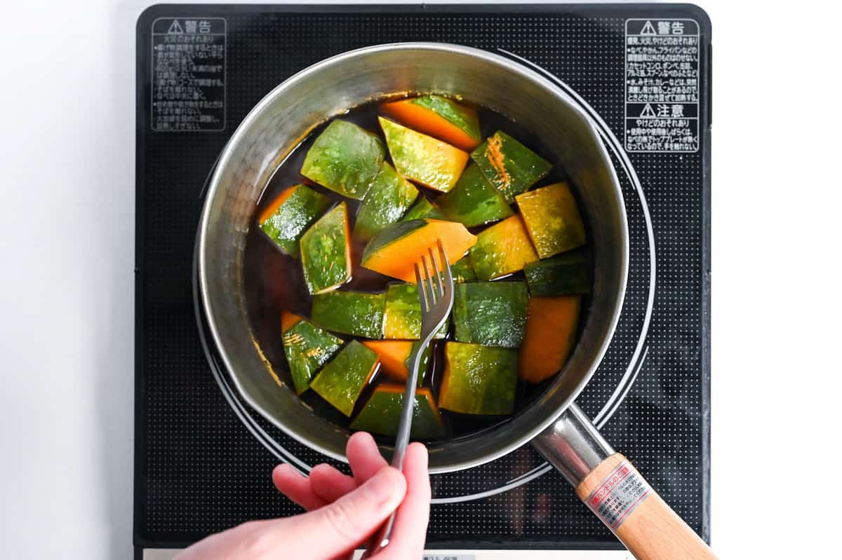 piercing kabocha with a fork